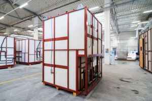 A single prefabricated bathroom pod with white cladding on a steel frame.