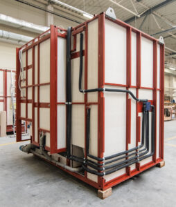 Side of a prefabricated bathroom pod with the drainage installation routed in place.